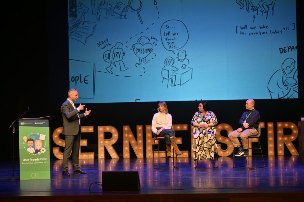 Facilitator Menno Spaan on stage with panelists Charlotte Vorbeck, Shanne deFreitas and Jett Pisate Virangkabutra