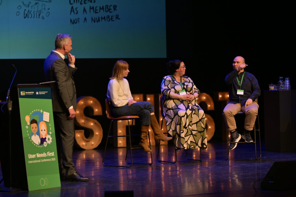 Facilitator Menno Spaan on stage with panelists Charlotte Vorbeck, Shanne deFreitas and Jett Pisate Virangkabutra (from a different angle)